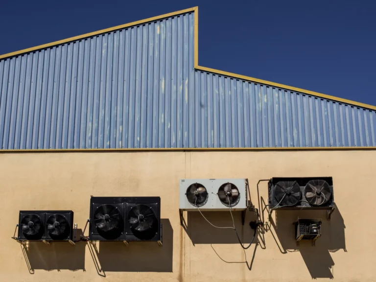 Industrial air-conditioning units mounted on a commercial warehouse exterior