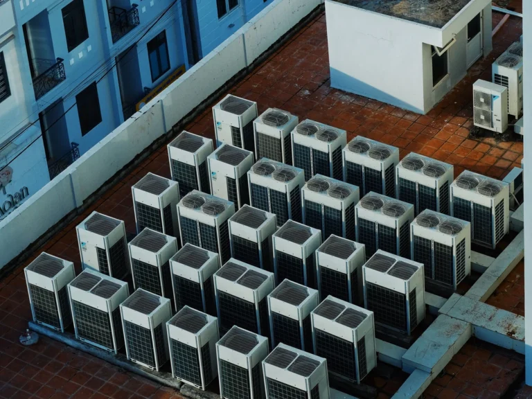 Commercial Rooftop HVAC Units Commercial rooftop HVAC condenser units arranged across a building roof