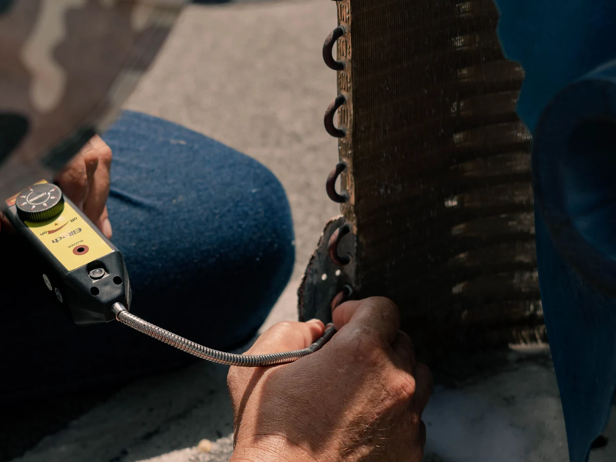 Commercial HVAC Technician Stock Photograph Commercial HVAC technician servicing an outdoor air-conditioning unit