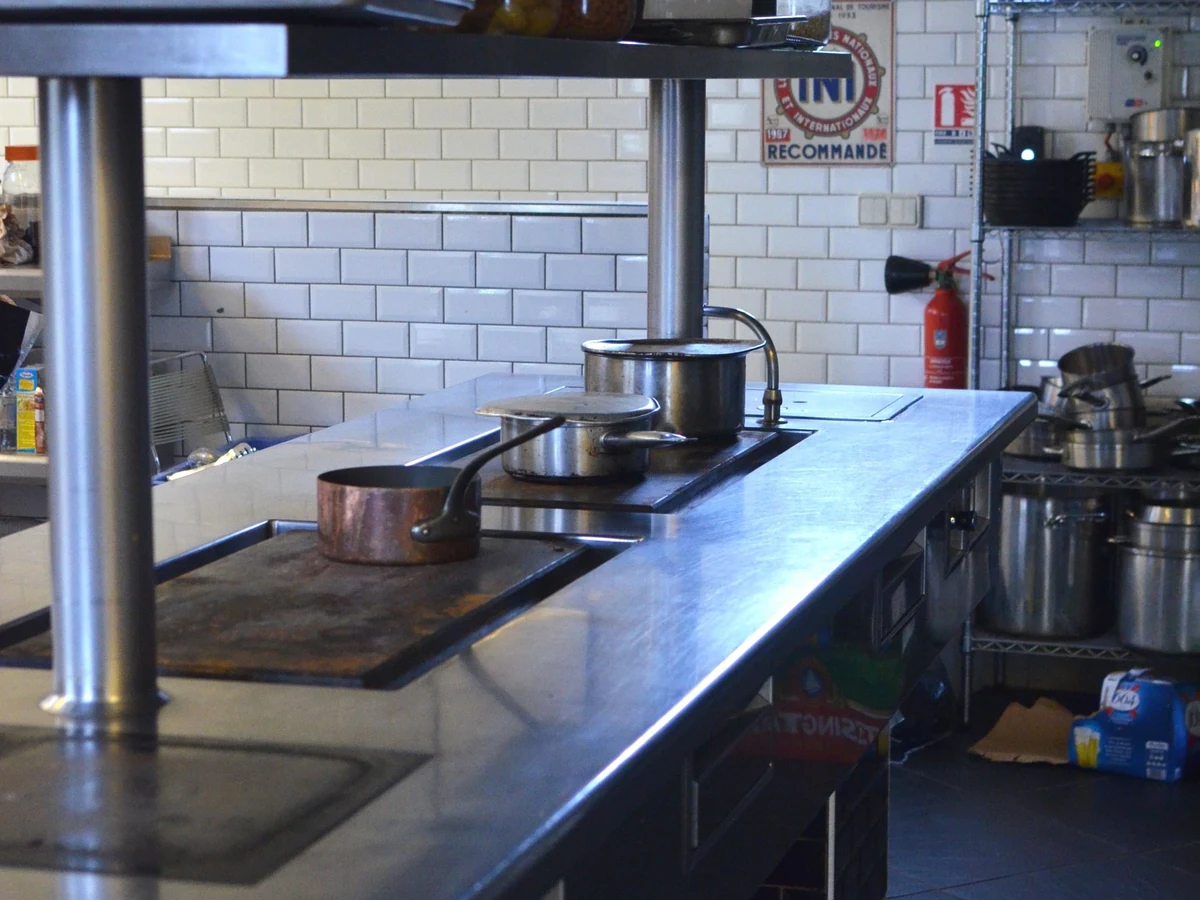 Commercial Kitchen Interior Stock Photograph Stainless-steel work surfaces and equipment in an empty commercial kitchen
